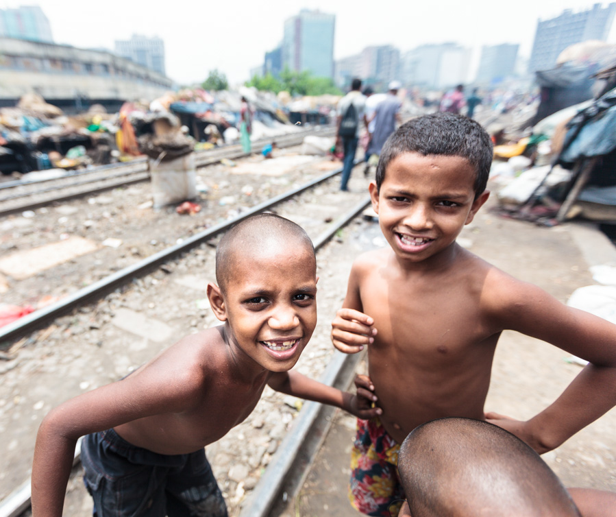 Bangladeshi kids playing and posing in front of the camera at Karwan slum, Dhaka, Bangladesh, Indian Sub-Continent, Asia