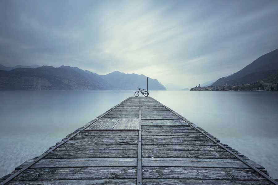 bike on lake in mountains of italy