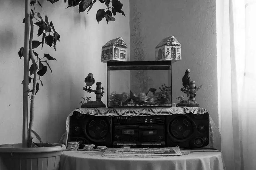 A broken aquarium sits on a tape recorder out of cervice (Ion Cojocea's house - neighborhood "New Town").