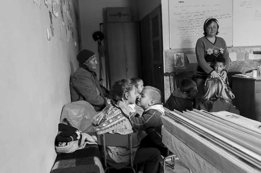 Two children are on the verge of kissing during Sunday School classes held in "New Hope" Baptist Church in the neighborhood "New Town" in Anina.