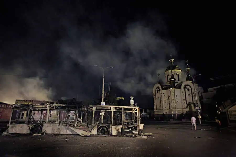 A trolley-bus, destroyed by the artillery strike seen on the railway station' square, center of Donetsk, which was subjected to artillery bombardment by the Ukrainian army, which has blocked the city, hoping to take it under control. August 30, 2014, Donetsk, Eastern Ukraine
