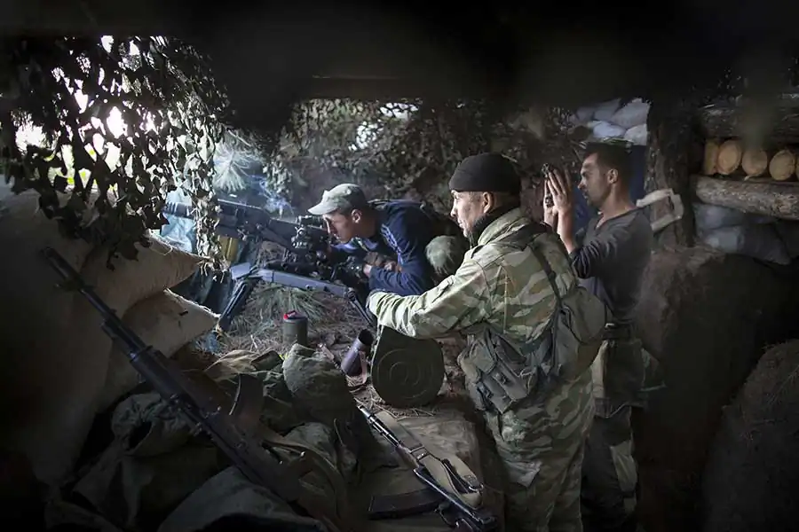 Separatist fighters checking their ammo on the frontline nearby Yasenovataya town, September 03 2015, Yasenovataya, East of Ukraine