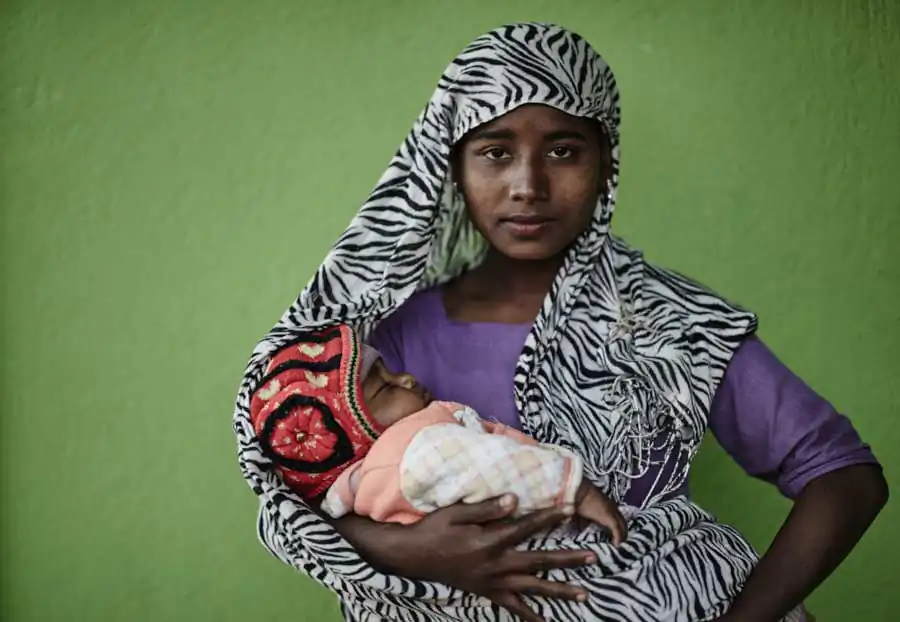Young mother with her baby. They belong to the Rohingya commnity in Mynamar and live as illegal refugees in Kathmandu.