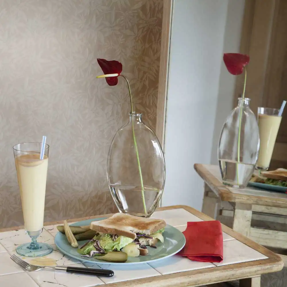 From 'Fictitious Feasts', work about food scenes in literature. Here in one of the numerous occurences of sandwiches and malted milk in solitude scenes, from the American novel "The Catcher in the Rye" by David Jerome Salinger