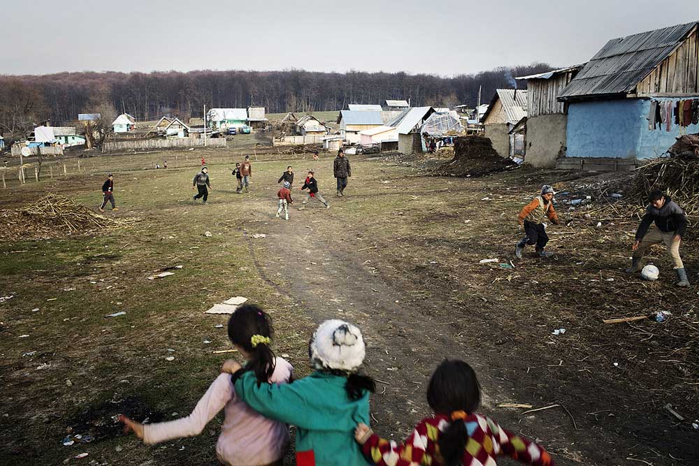 Romanian kids of Roma origins play football as seen in Poaina Negustorului on March 18, 2013. In today's Romania there are many barriers facing Roma in access to health care, including structural disadvantages resulting from the operation of general policies and administrative practices such as the disproportionate exclusion of Roma from health insurance; barriers to access to health care and other disparate impacts on the health of Roma stemming from continuing discrimination in other areas such as education, housing and employment, as well as from discriminatory practices by health care practitioners.