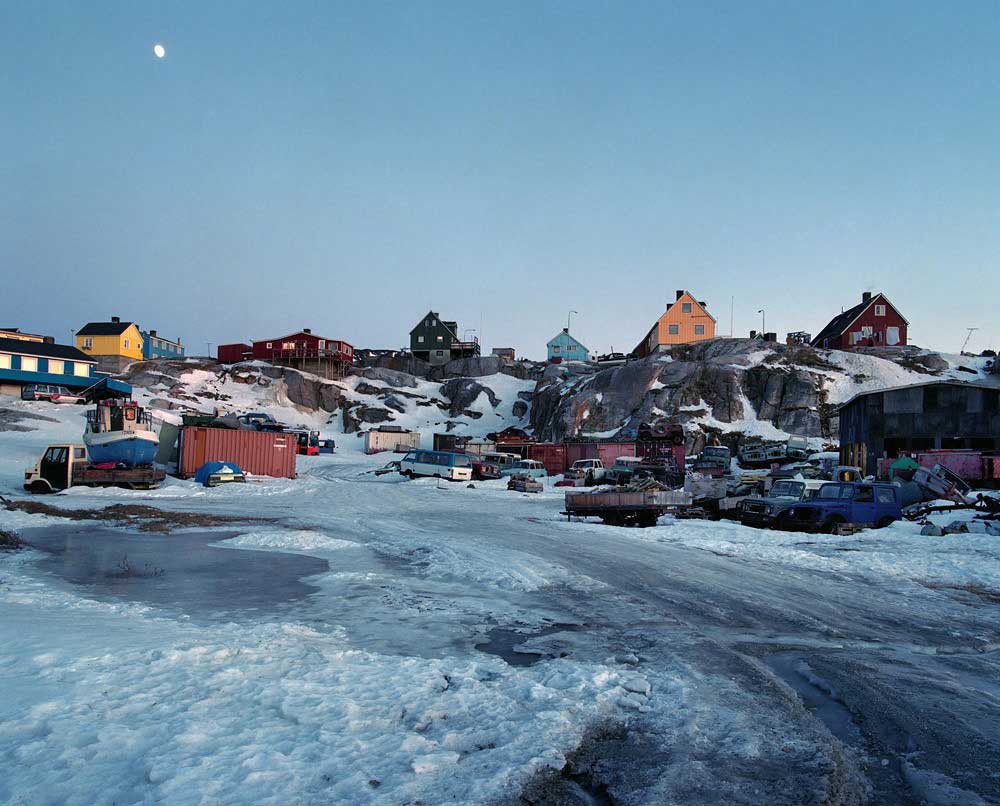 Transportations between towns are mostly done by plane or helicopter. There is no road network in Greenland, however cars and even taxis are now part of the urban landscape. But as a consumer society emerges, so too does the problem of waste management. Generally speaking, the edge of a town is usually designated as a dumping ground. Here is a car cemetery in Ilulissat.