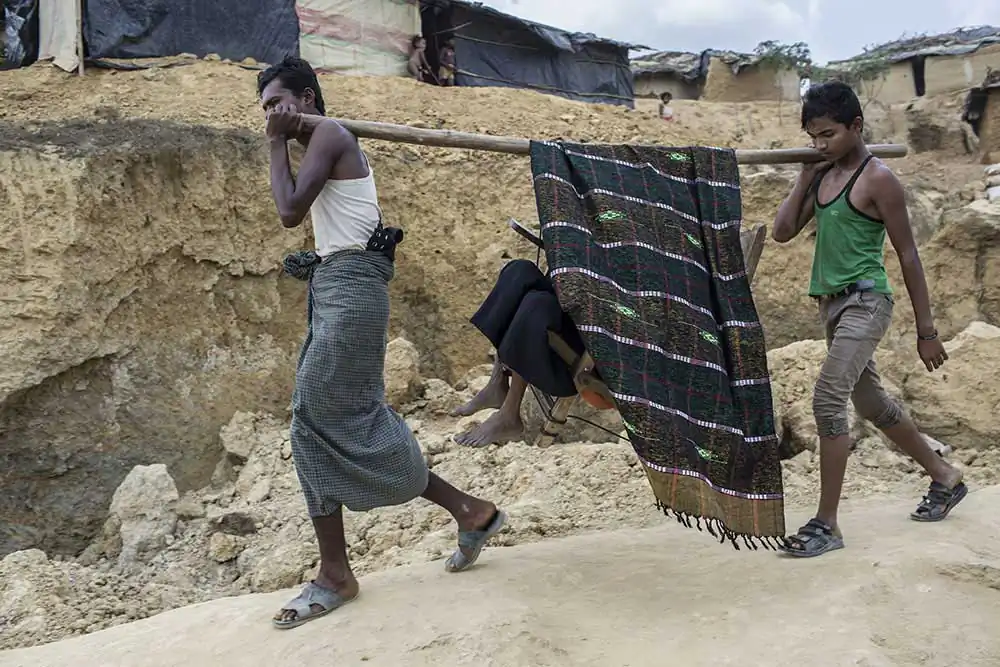 Fatema Khatun(50) is a Rohingya refugee, who fled from violence against Muslim in Myanmar, is being carried on bamboo to the hospital due to lack of transportation in Kutupalong refugee camp on March 6, 2017 , Cox's Bazar, Bangladesh.
