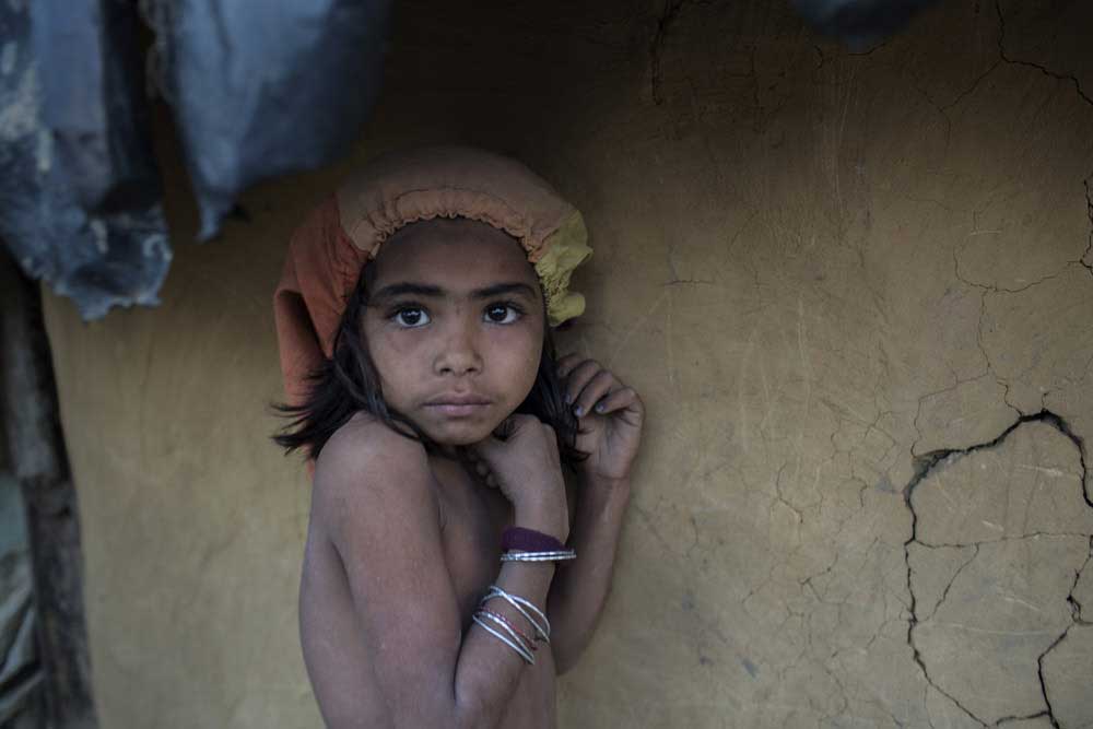 Sommaya, 7, is frightened as she has seen how the Burmese military tortured her father and burned their house. Her family fled from Myanmar to Bangladesh, and has taken new shelter in Kutupalong Rohingya refugee camp.