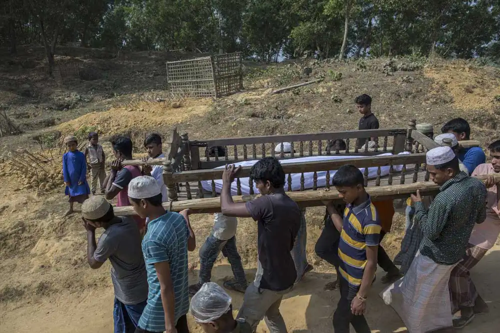 Rohingya refugees attend the funeral of Khalek, 16, who died from Diarrhea in Kutuplanong refugee camp on March 05, 2017, Cox's Bazar, Bangladesh.