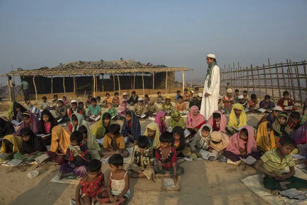 Rohingya refugee children attend an open air Arabic school in Kutupalang newly expanded Refugee Camp, where they learn to read the Quran.