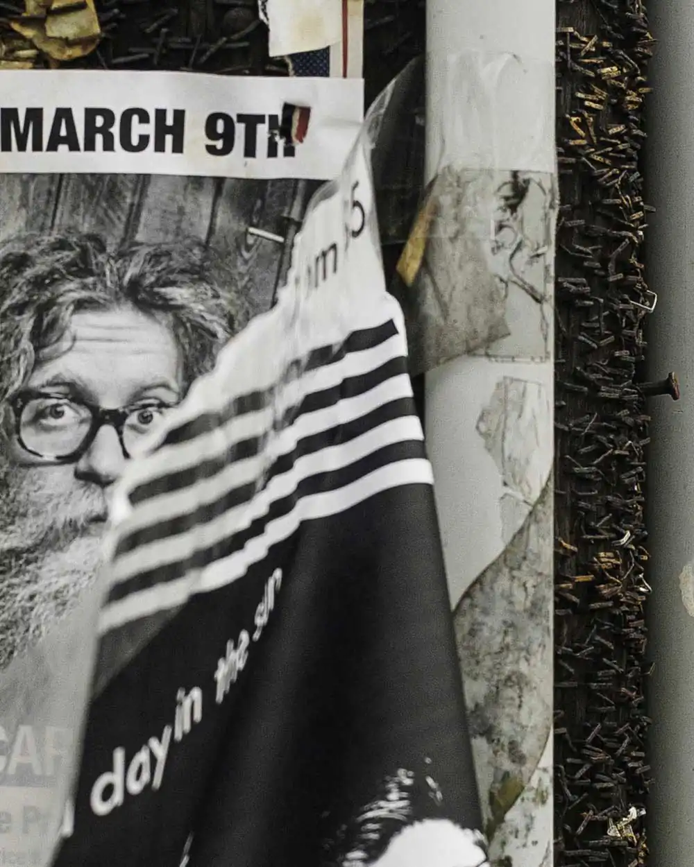 As people pass through a city; Poster faces by Kip Harris